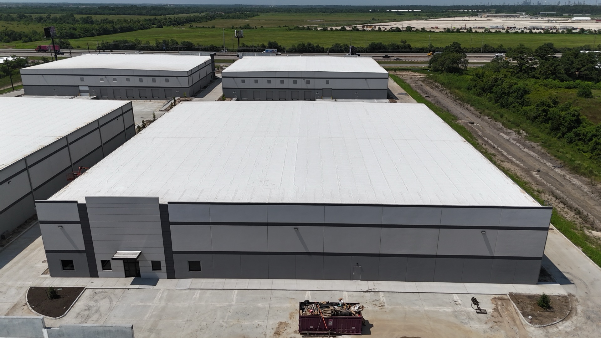 Building 4 — aerial back view, July 2026