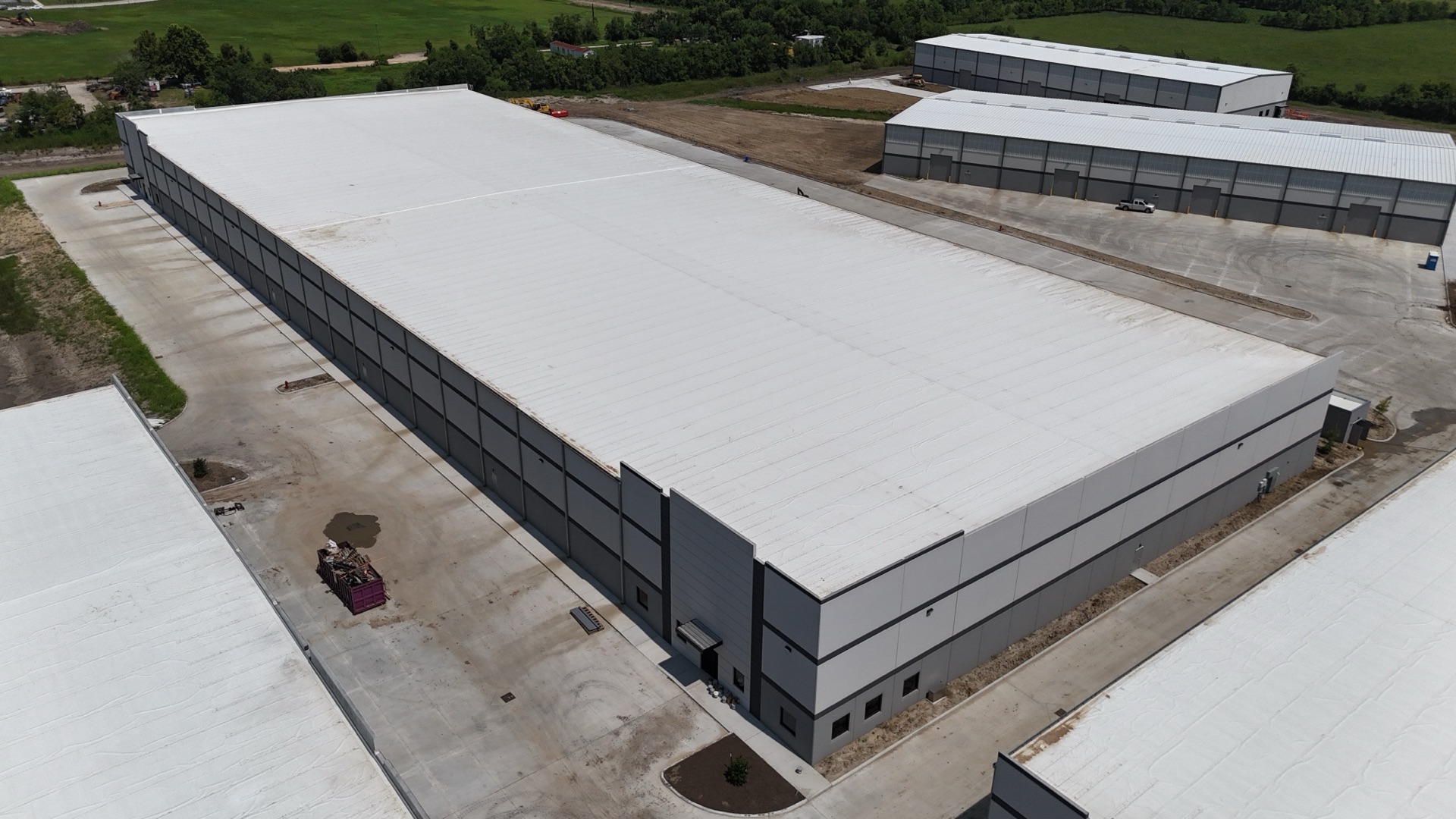 Building 6 — aerial view, July 2026